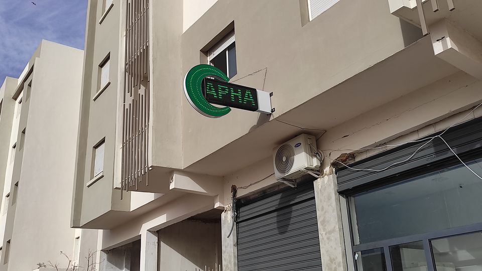 Illuminated green LED pharmacy cross