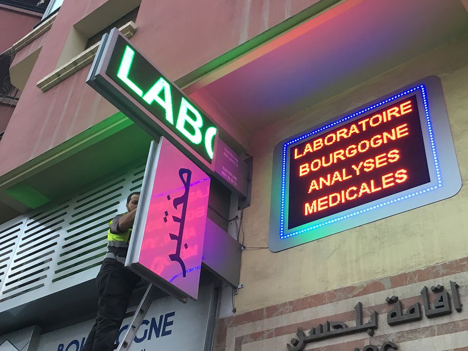 Illuminated projecting sign and LED display for a laboratory
