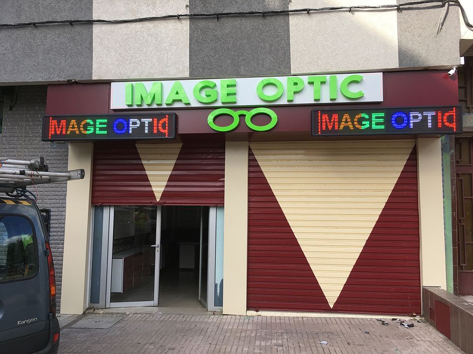 Illuminated shop sign on a storefront