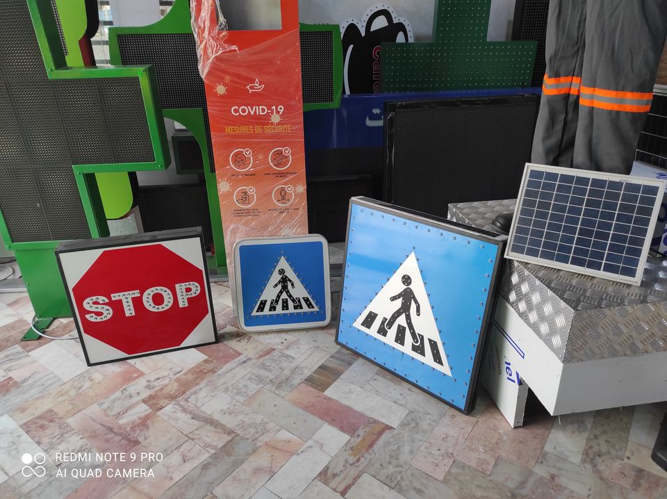 Set of LED traffic signs: stop, pedestrian crossing and solar panel