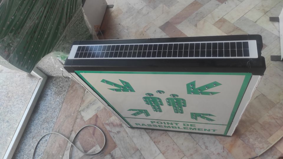 Solar-powered illuminated 'assembly point' sign